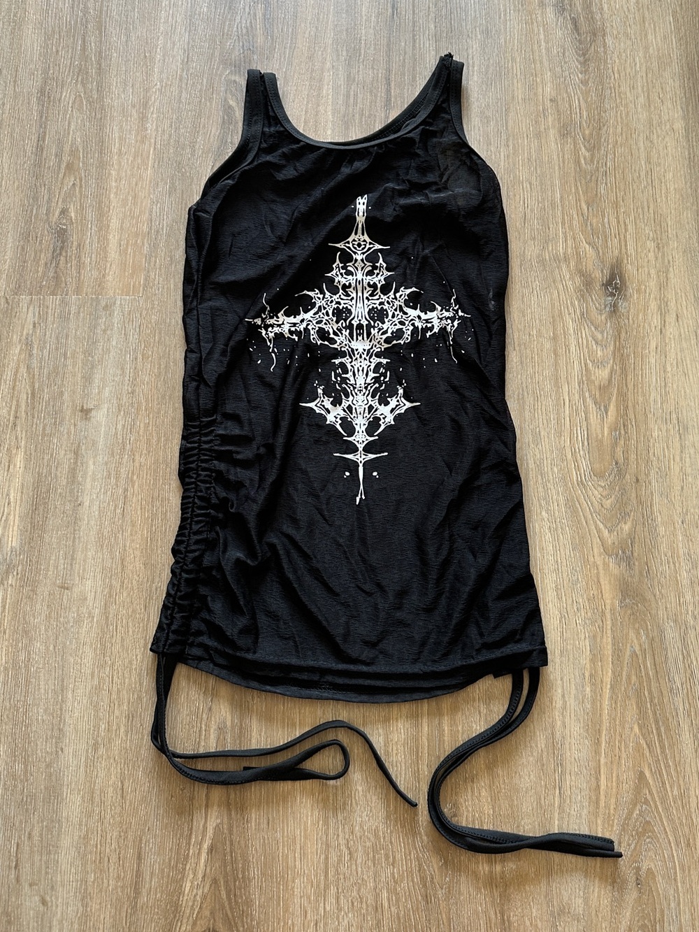 Black mesh tank top with white ornate cross graphic and adjustable tie ruching